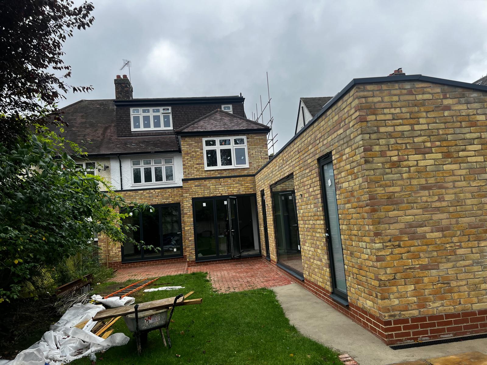 Finished rear extension in yellow London stock brick with bifold doors
