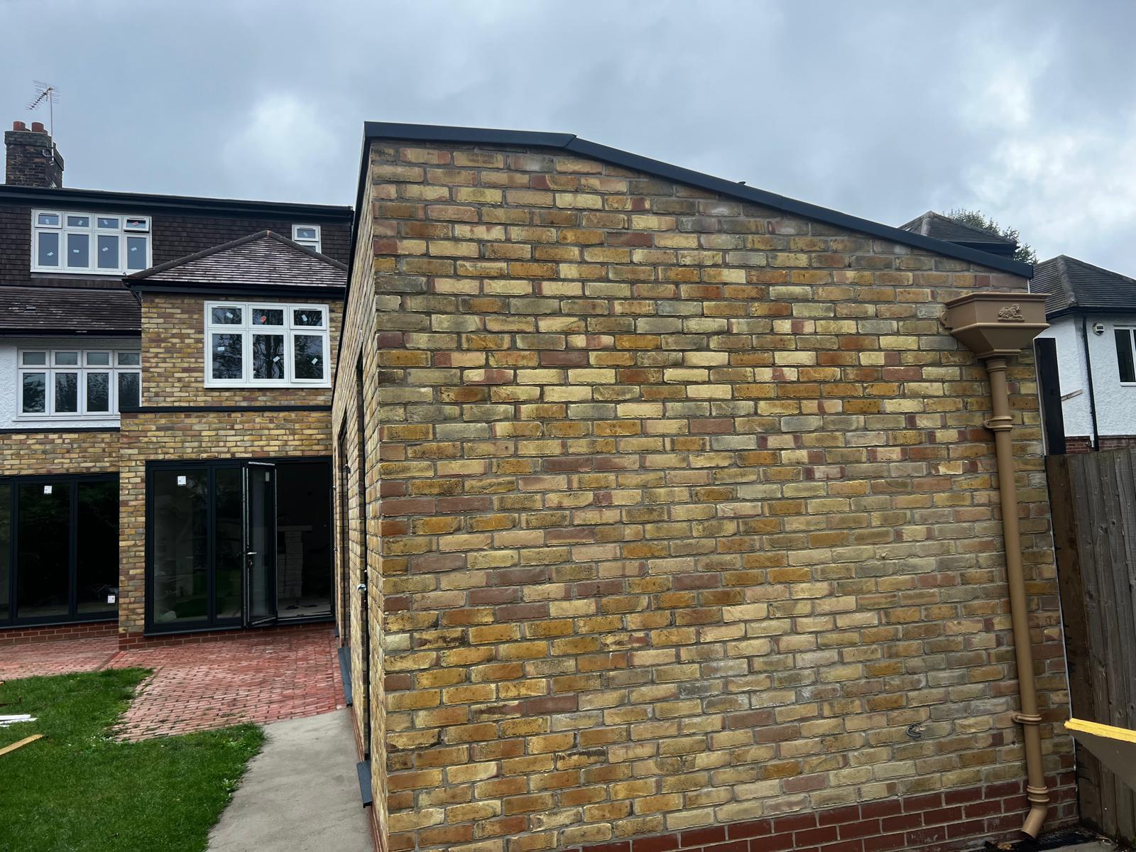 Finished yellow stock brick gable end on rear extension