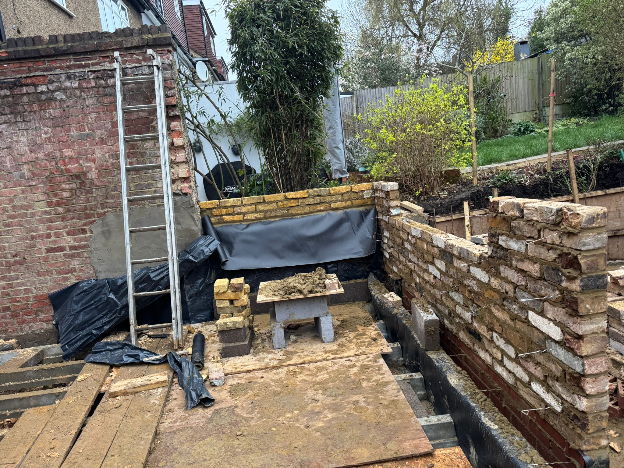 Garden brickwork in progress with raised earth